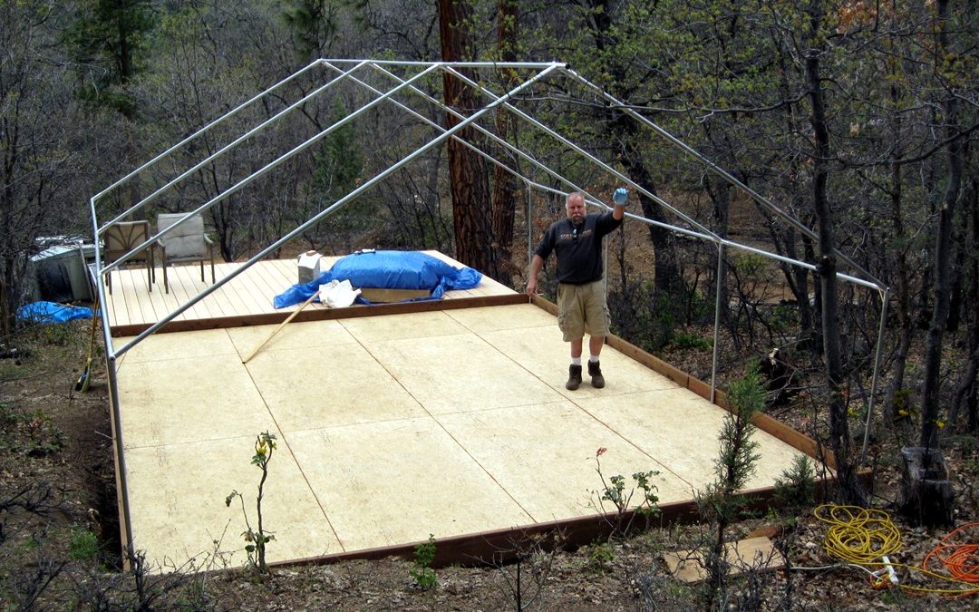 Camper sets up a wall tent