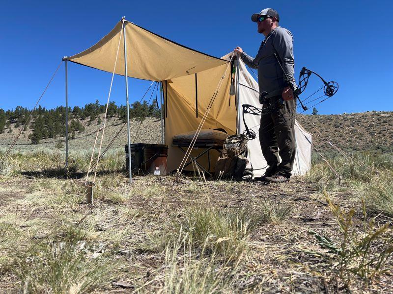 Hunter outside his tent